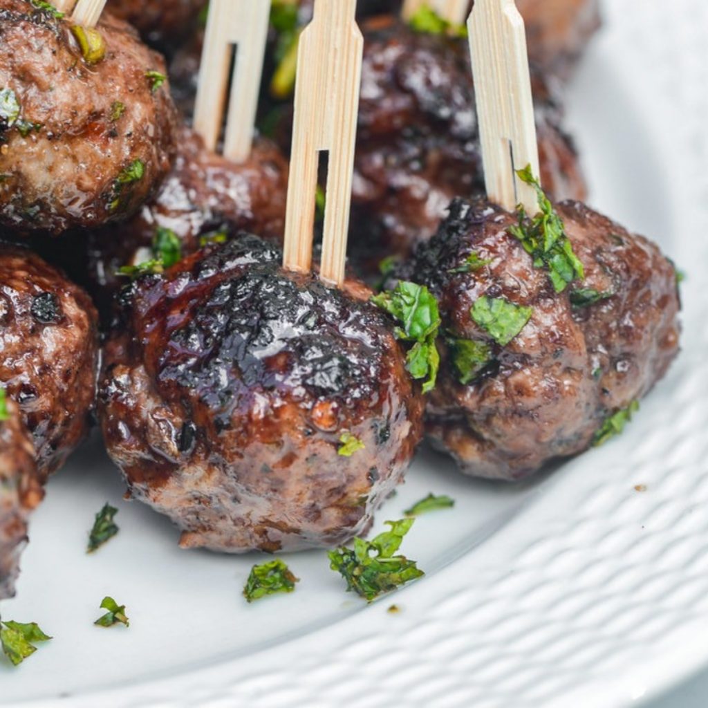 Meatballs glazed in pomegranate sauce.