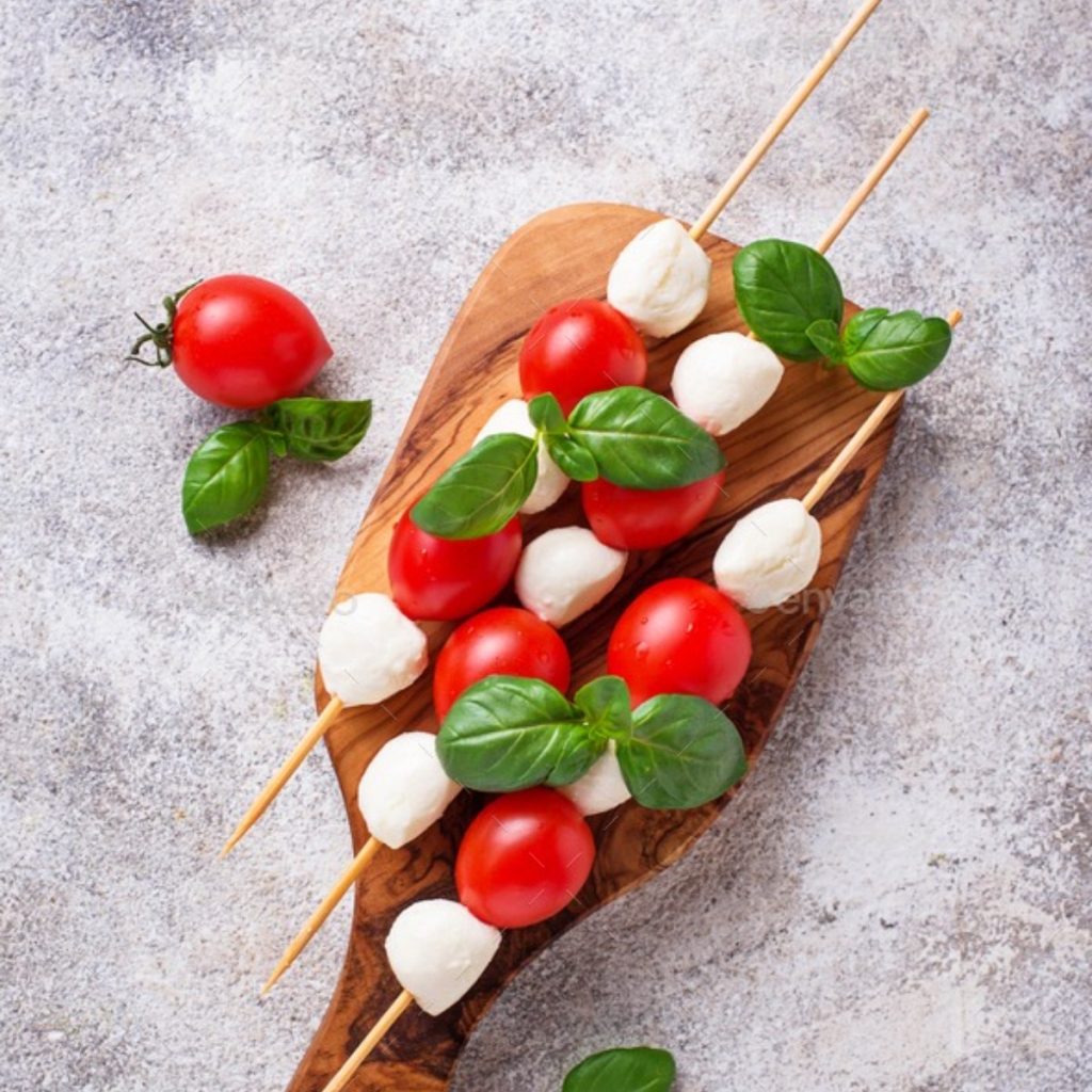 Make the freshest stick-to-your-ribs snack ever with just three ingredients: mozzarella, cherry tomato slices, and a sprig of basil. Try adding some balsamic vinegar and olive oil for extra taste.